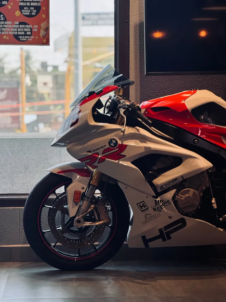 White and red superbike by a window